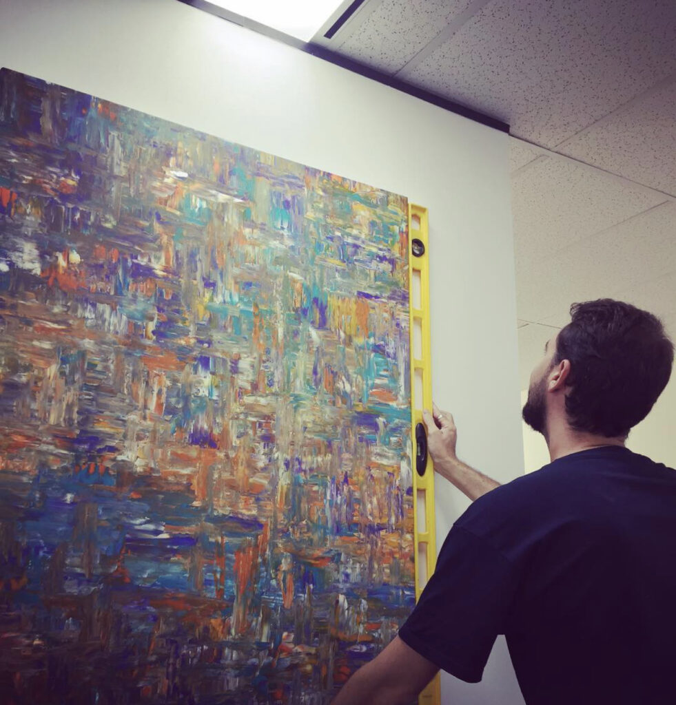 Experts at hanging wall art professionally and securely