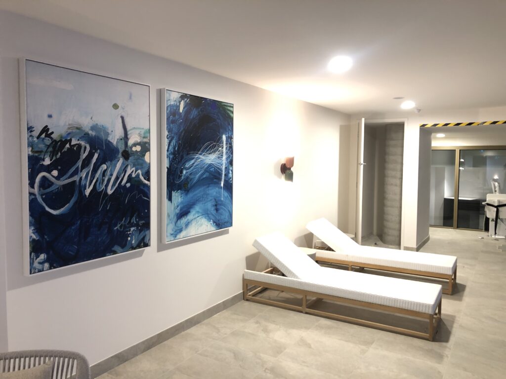 Seasonal wall decor being swapped using a damage-free hanging system
