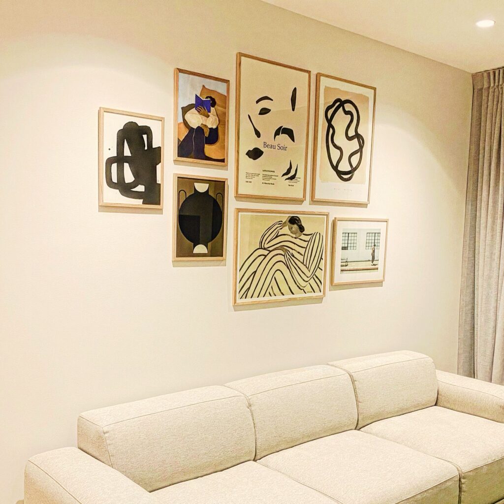 Artwork hung above sofa with 15-25 cm gap